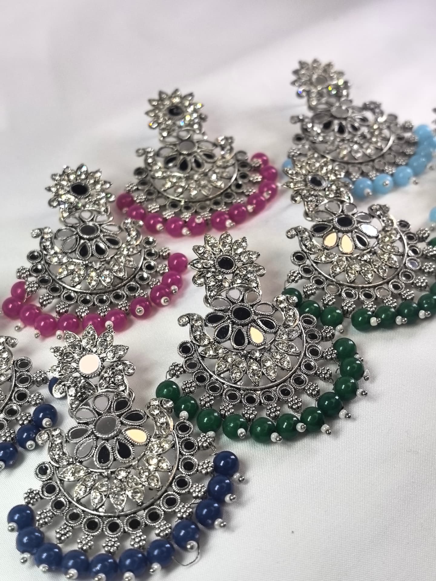 Silver mirror-work chandbali earrings in pink, blue, green and navy beads